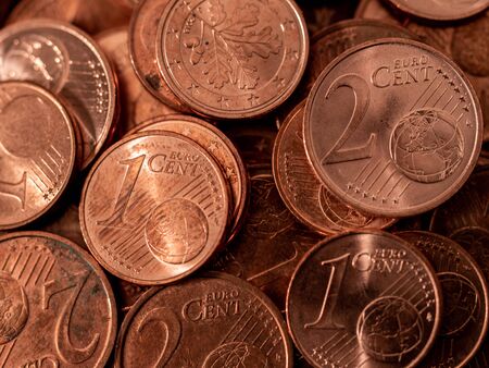 background full of Euro cents, copper coin, one and two cents coin will be dismissedの写真素材