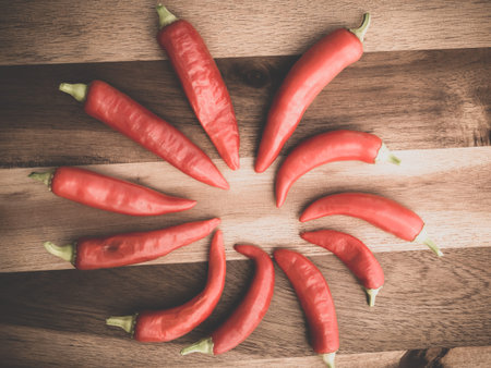 Decoration of chili peppers on wodden board. Set.