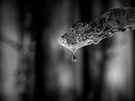 Melting ice with water drop on blurry background, Close upの写真素材