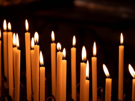 Image of many burning candles with shallow depth of field, close up.の写真素材