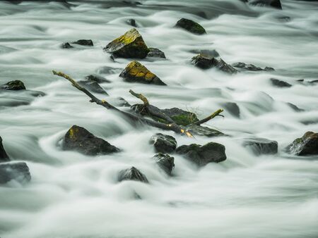 Long exposure of a wild river, close up.の写真素材