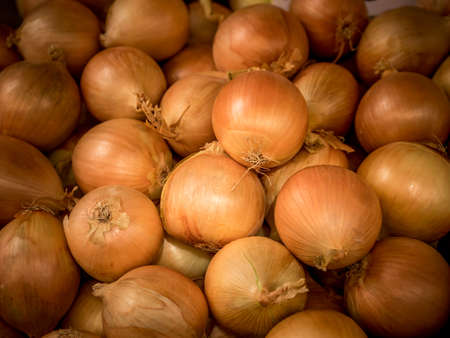 Fresh onions. Onions background. Ripe onions. Onions in marketの写真素材