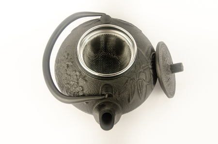 Black kettle for brewing tea. Along with a lid. From above. white backgroundの写真素材