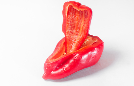 Pieces of red pepper on white backgroundの写真素材