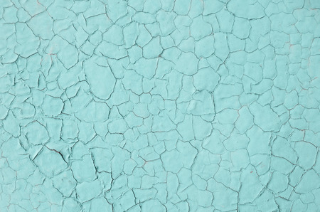 The texture of the turquoise paint on the metal surfaceの写真素材