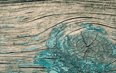 The paint is almost lost from planks of wood, green paint on the bottom of the board, texture, wallpaperの写真素材
