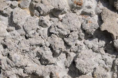 Texture, wallpaper, frozen pieces of cement on the rocks. Gray color, close-upの写真素材