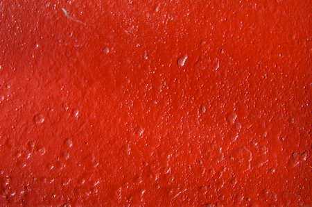 The texture of the hole in the fresh red paintの写真素材