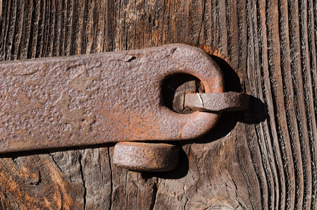Old metal fixture on good wooden boards, texture, horizontal color photoの写真素材