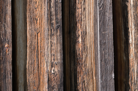 The texture, wooden dark brown brown boards are arranged vertically. Horizontal photo, color photo, wallpaperの写真素材