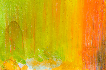 Orange, yellow and lemon paint on the canvas, verticalの写真素材