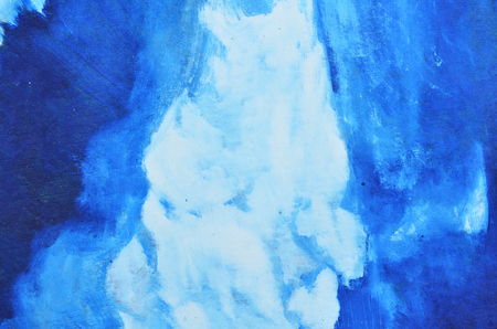 White and blue watercolor paints are mixed on canvas. Texture, wallpaper, backgroundの写真素材