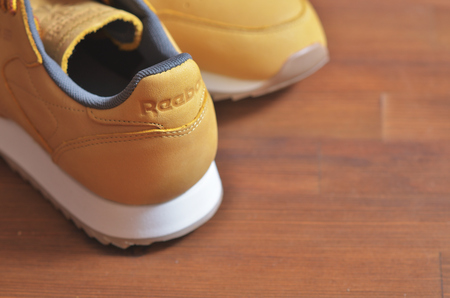 Kiev, Ukraine - May 30, 2018: Reebok photo of the back of a brown sneaker on a wooden backgroundのeditorial素材