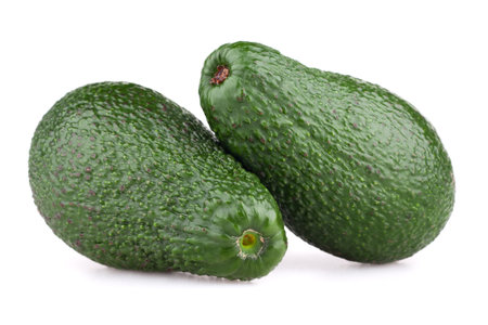 Fresh tropical avocado isolated on white background