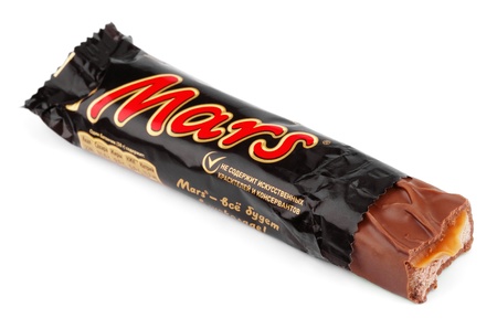 Closeup of unwrapped Mars candy chocolate bar made by Mars Inc. isolated on white backgroundのeditorial素材