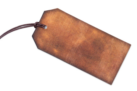 Blank brown leather tag isolated on white backgroundの写真素材