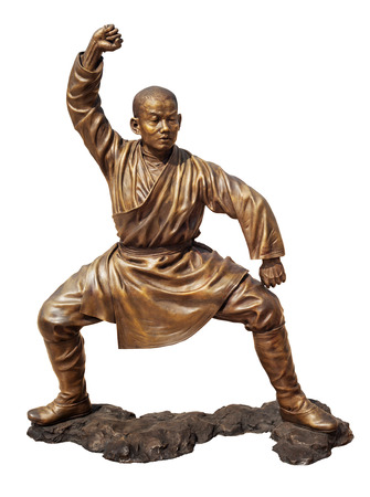 Shaolin warriors monk in Chinese Temple Viharn Sien, Chonburi, Thailand. Bronze statue isolated on white with clipping pathの写真素材
