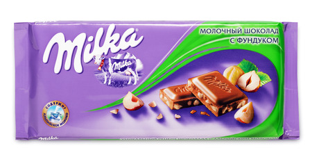 Bar of milk chocolate Milka with hazelnut made by Mondelez International isolated on white with clipping pathのeditorial素材