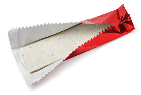 Chewing gum plate wrapped in red foil isolated on white with clipping path