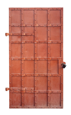 Closed big old door with rusty key isolated on white background with clipping pathの写真素材