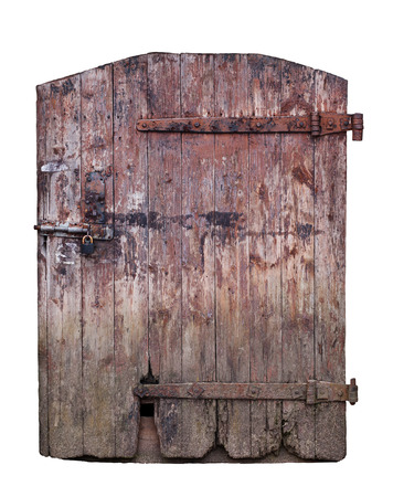 Closed big old door with rusty key isolated on white background with clipping pathの写真素材