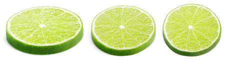 Set of sliced lime citrus fruit lying down isolated on white background. Lime slices with clipping...