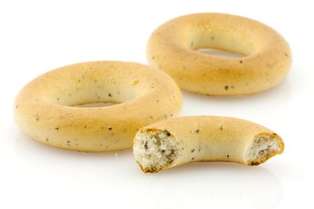 Two and a half bread rings with poppyseed の写真素材