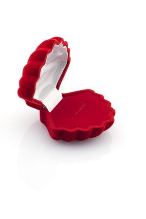 Empty red velvet gift box in a form of a shell, isolated on whiteの写真素材