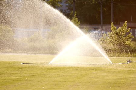 Fire hose badly leaking, outdoorsの写真素材