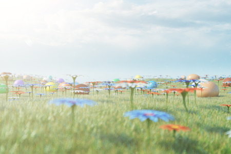 Colorful eggs in a meadow on a sunny day against the blue sky. Multicolored painted easter eggs on grass, lawn. Concept easter eggs hunt in sunday. Easter symbol holiday in April, 3D illustrationの写真素材