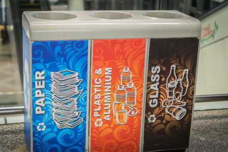 colorful recycle bins - paper, plastic, glass