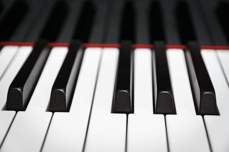 Piano keys on black classical grand piano play