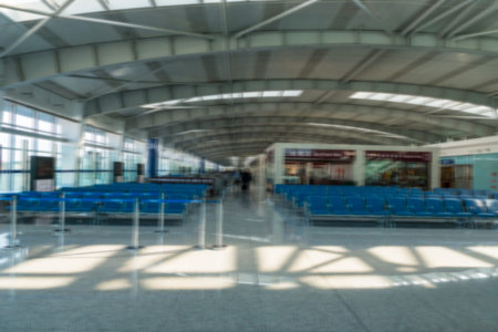 Airport departure terminal with passengers - blurred abstract photo