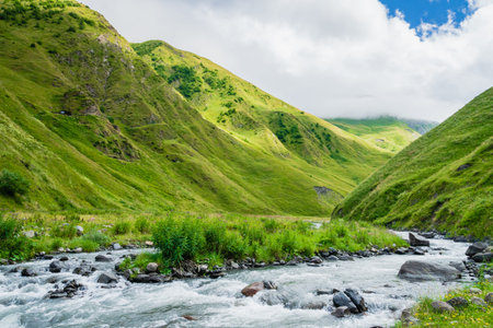 Mountain region landscape in Kazbegi, Georgia - Dramatic landscape of popular adventure trekking and...
