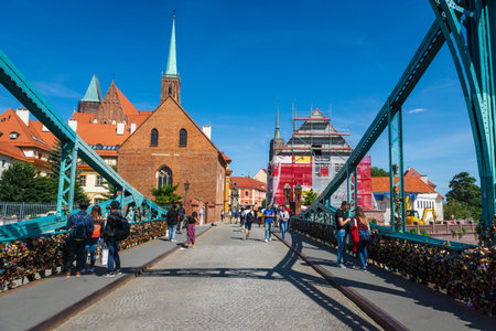 Wroclaw, Poland - July 2019: Tumski Bridge (is also called Lovers Bridge, Cathedral Bridge or Green...