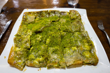 Katmer, famous Turkish dessert in Gaziantep, the food capitol of Turkey. Katmer, or Katlama, is a...