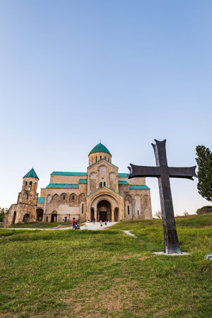 Bagrati Cathedral in Kutaisi, Georgia with sunset sky. Bagrati Cathedral is a tourist attraction in...