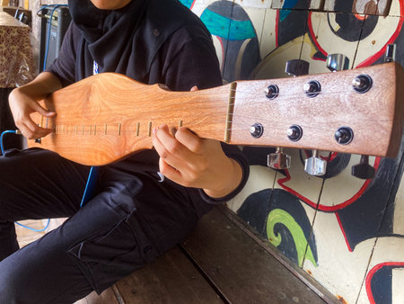 Sapeh, or Sape, a traditional Dayak string instrument of Borneo origin that commonly developed in...
