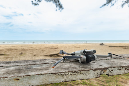 modern drone camera for aerial photography at beach, defocused background