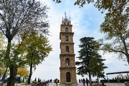 Bursa, Turkey - November 2021: Bursa historical clock tower in Tophane park in Bursa, Turkey.
