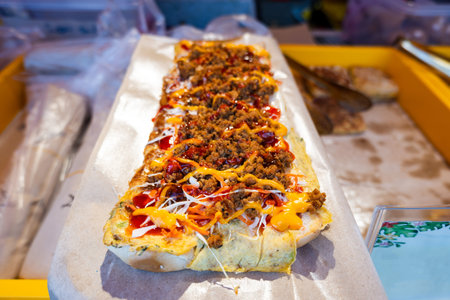 Roti John, a popular street food in Malaysia and Singapore. Roti john is an omelette sandwich which...