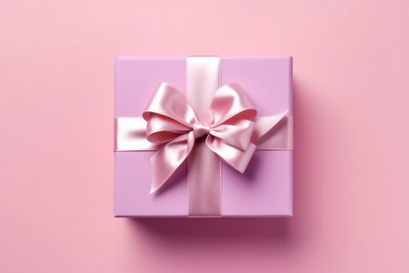 Pink gift box with ribbon on pink background AIの素材