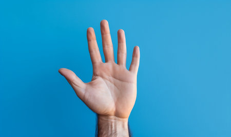 Male Hand Making a "Hand Up" Gesture on a Blue Background. AIの素材
