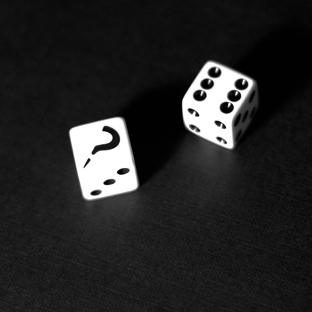 Two white dices on a black backgroundの写真素材