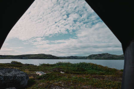 view from the tent to the mountainsの写真素材