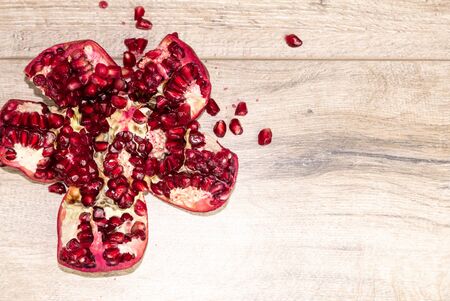 Pomegranate on a wooden tableの写真素材