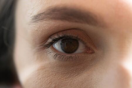 Beautiful brown woman single eyeの写真素材