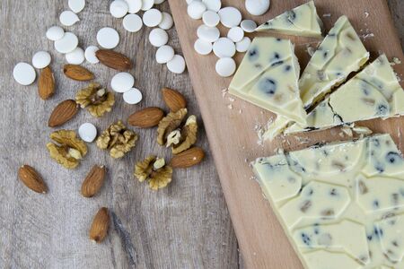 Chocolate homemade granola with almonds, blueberries and greek yogurt on white backgroundの写真素材