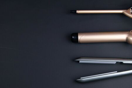 Composition of hairdressers instruments on black textured backgroundの写真素材