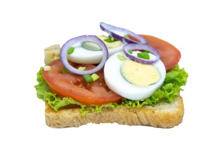 Sandwich with lettuce, eggs, tomatoes and purple onions. Isolated on a white background. Front viewsの写真素材